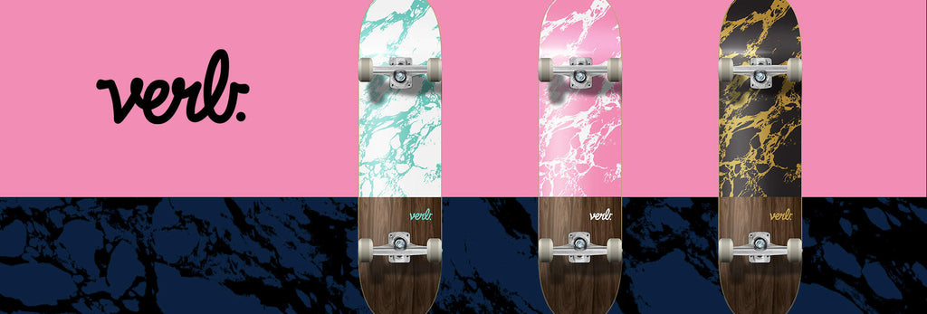 Verb Skateboards Marble Series in Green, Pink and Gold on pink and blue marble background
